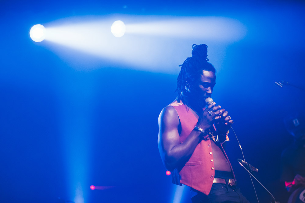 In colour - Fulu Miziki. Taken for Sea Change 2022. The image in black and white works better than the colour version as the blue lights detract from the main subject. Copyright: Claire Gillo